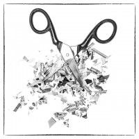 tijeras sobre papeles recortados en blanco y negro